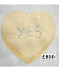 A heart shaped canvas with the word " yes " written on it.