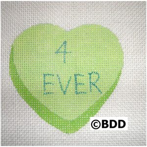 A heart shaped green sticker with the word " 4 ever ".