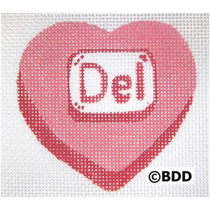 A heart shaped canvas with the word " del " written on it.