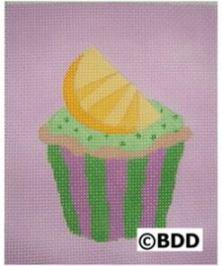 A cupcake with a lemon slice on top of it.