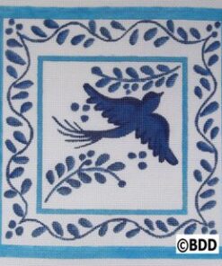 A blue bird is flying in the sky.