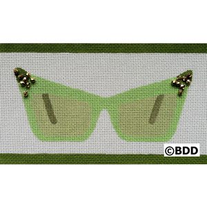 A green pair of sunglasses with butterflies on them.