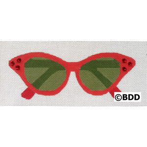 A red sunglasses with green lenses and ladybug accents.