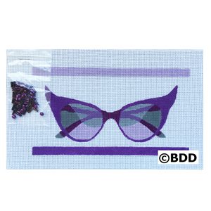 A purple pair of glasses sitting on top of a table.