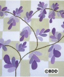 A purple flower is on the ground in front of a checkered background.