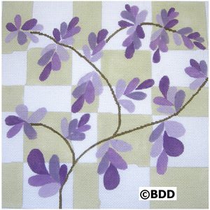 A purple flower is on the ground in front of a checkered background.