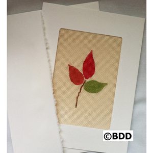 A card with a picture of leaves on it.