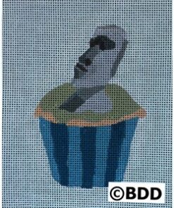 A bird sitting on top of a cupcake.