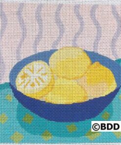 A blue bowl of lemons on a table.