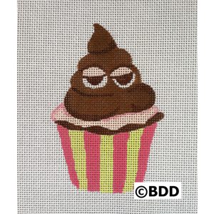 A brown cupcake with glasses on top of it.