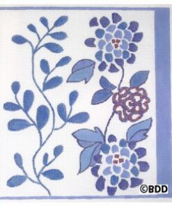 A blue and white tile with flowers on it.