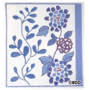 A blue and white tile with flowers on it.