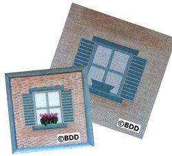 A picture of a window with shutters and flowers.