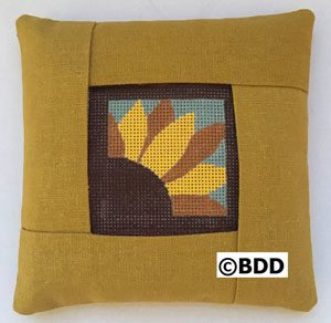 A yellow pillow with a picture of a turkey.