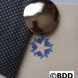 A close up of a button on fabric