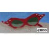 A red pair of sunglasses sitting on top of sand.