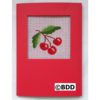 A red card with a picture of cherries on it.