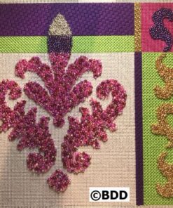 A purple and green quilt with a candle on it.