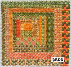 A square of green and orange with some designs in it