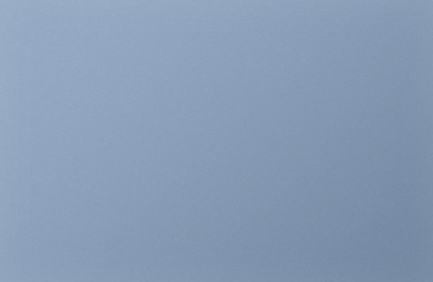 A light blue background with a pattern of small dots.