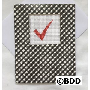 A black and white checkered card with a red check mark.