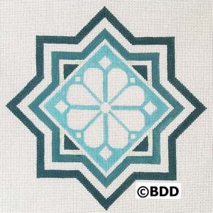 A blue and white geometric design with a flower.