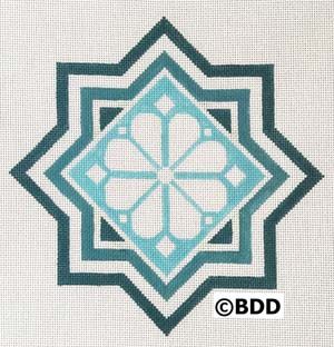 A blue and white geometric design with a flower.