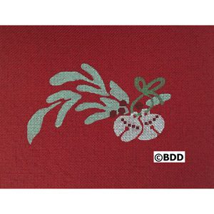 A red cloth with a plant and two white flowers.