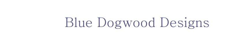 A dog is standing in front of the word dogwood.