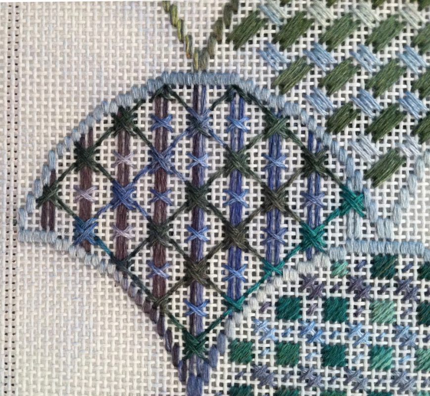 A close up of the cross stitch pattern