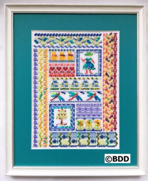 A framed picture of a quilt with various designs.