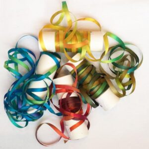 A bunch of colorful ribbons are laying on the table