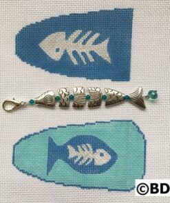 A fish bone and a fish hook with beads.