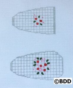 A pair of white slippers with red and green flowers.