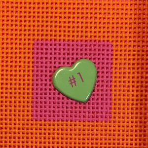 A green heart on top of a pink and orange background.