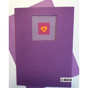 A purple card with a heart stitched on it.