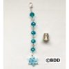 A blue bead with a small snowflake charm attached to it.