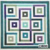 A square quilt with squares in different colors.