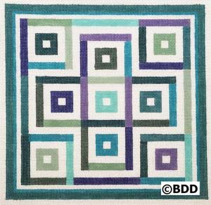 A square quilt with squares in different colors.