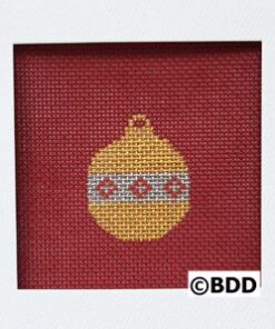 A red and yellow ornament is in the middle of a frame.