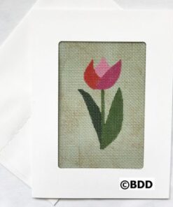 Pink tulip cross-stitch on mottled green