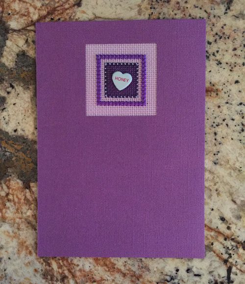 A purple card with a heart on it.