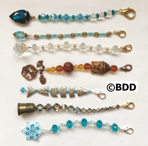 A group of different types of beads on top of each other.