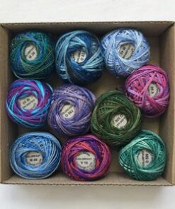 Variegated embroidery threads neatly arranged