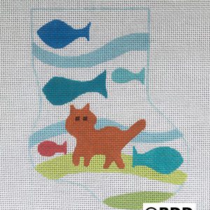 A cat with fish in the background on a stocking.