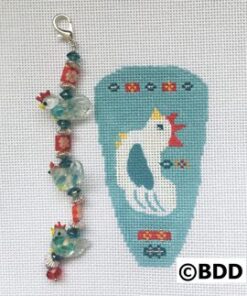 A blue and white bird with beads on it's tail.
