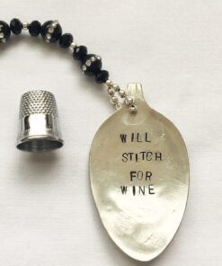 Spoon necklace with "Will Stitch For Wine".