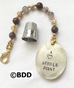A key chain with a thimble and beads