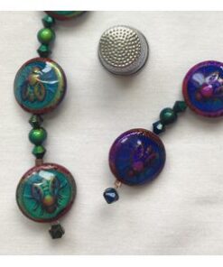 A close up of a necklace with beads