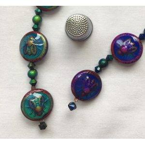 A close up of a necklace with beads